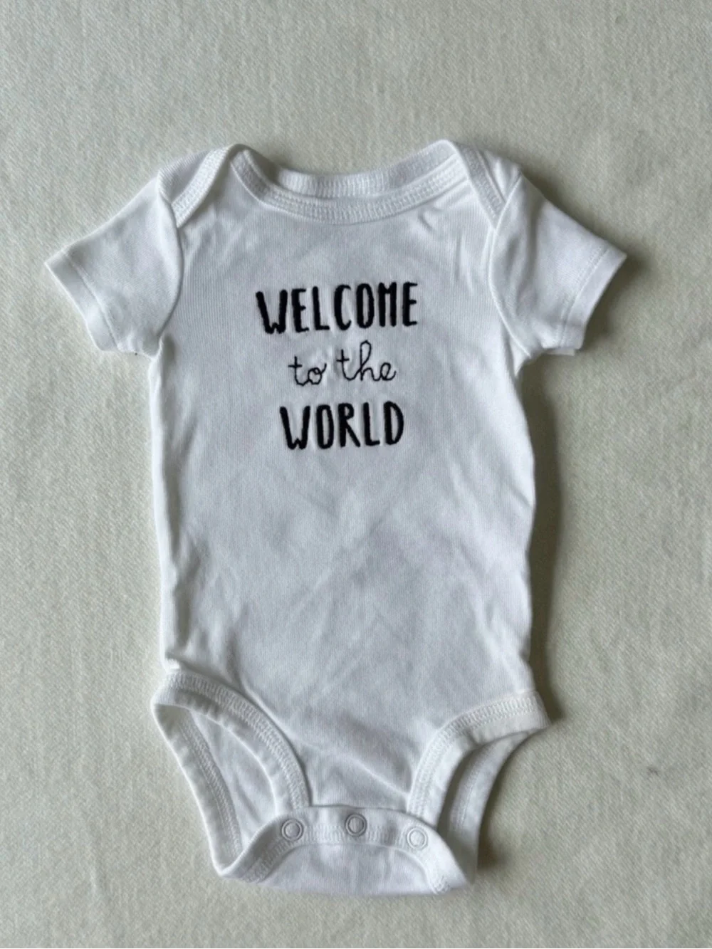 Carter's White Baby Onesie with Black 'Welcome' Script Newborn